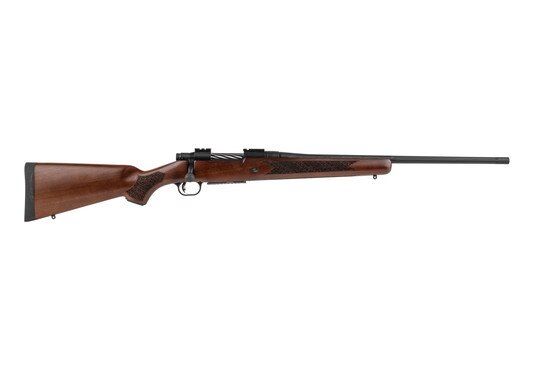 Mossberg 308 bolt action rifle features a walnut stock and grip